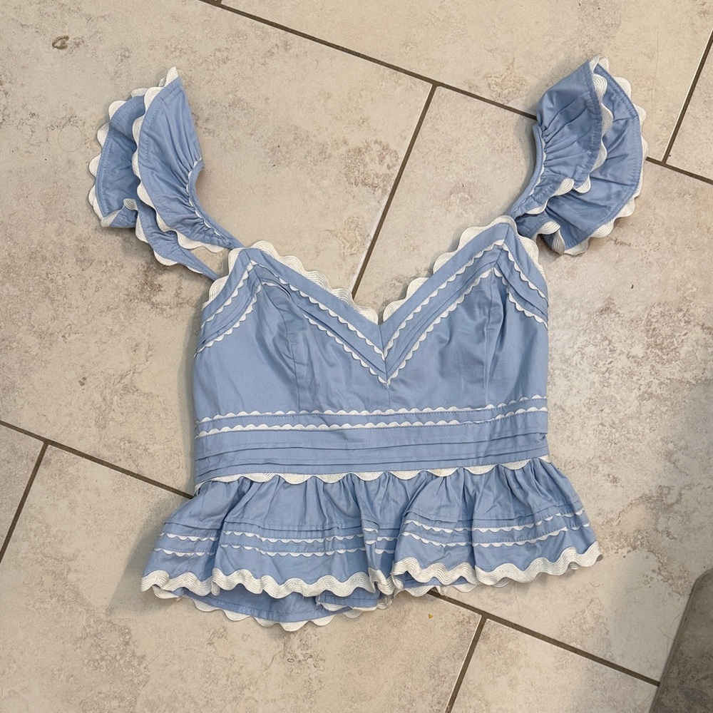 Elegant Blue Ruffled Blouse with White Trim